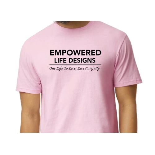 Empowered Life Designs T-shirt in light pink with bold black lettering reading Empowered Life Designs One Life To Live, Live Carefully.