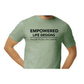 Empowered Life Designs T-shirt in sage with bold black lettering reading Empowered Life Designs One Life To Live, Live Carefully.
