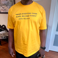 gold graphic tee with bold black lettering on the front reading "When Everyone Thinks Alike, No One Thinks"  John Wooden design by Empowered Life Designs.