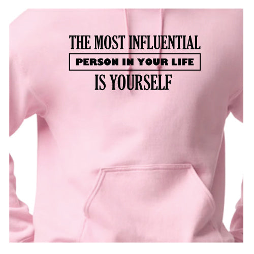 Empowered Life Designs hoodie with bold black lettering reading "The Most Influential Person in Your Life Is Yourself" on a front of light pink hoodies.